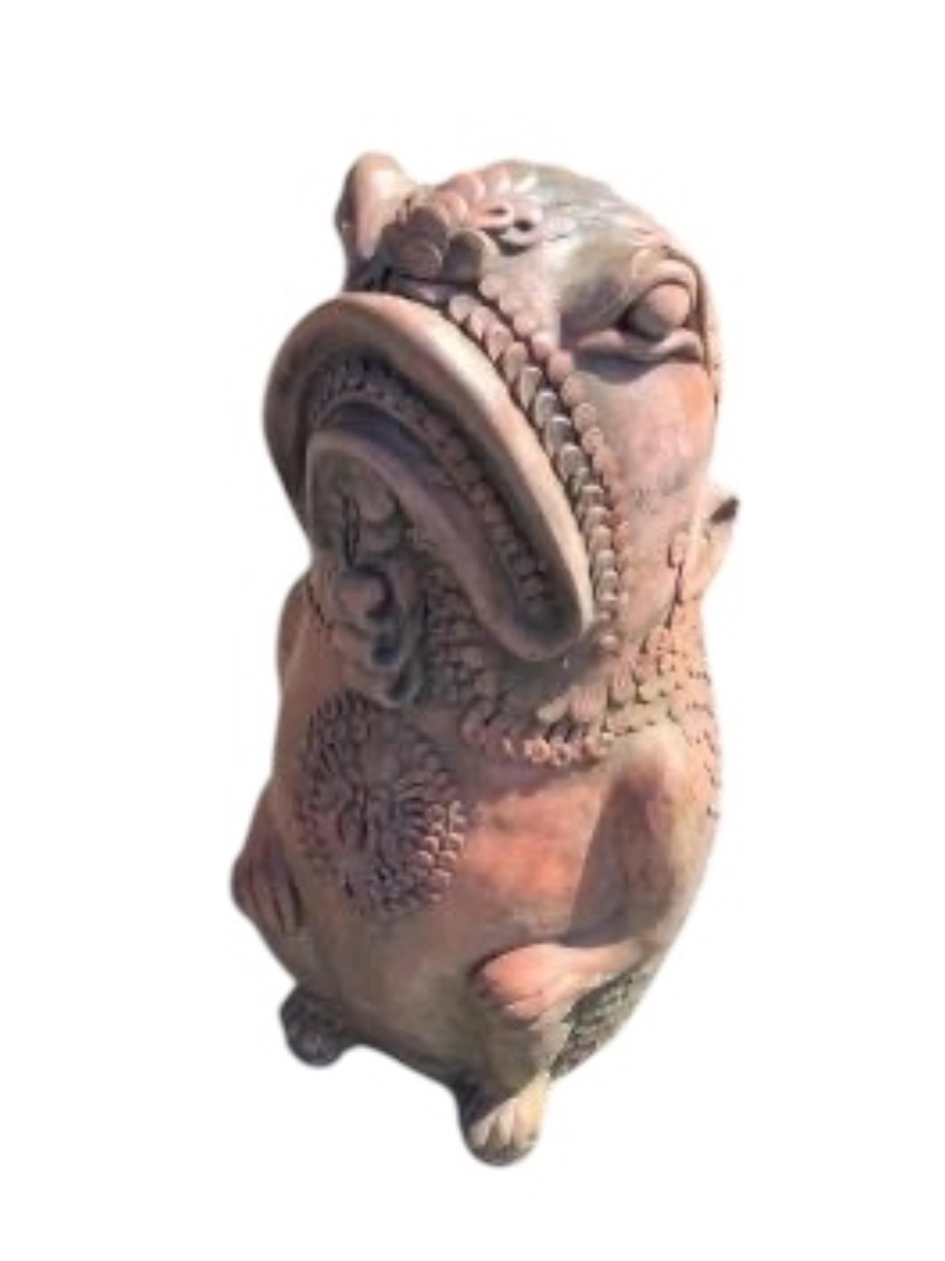 A pair of cast terracotta Oriental fish garden ornaments, height 61cm